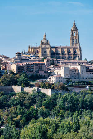 Low angle view of the side faÃ§ade of the Cathedral of Segovia, located in the main square of the city, the Plaza Mayor, and dedicated to the Virgin Mary.の写真素材