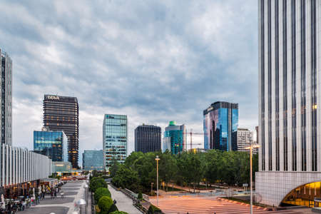 MADRID - MAY 1, 2021: Wide-angle view of AZCA business and financial district in Madrid at dusk, Spain. Long exposure.のeditorial素材