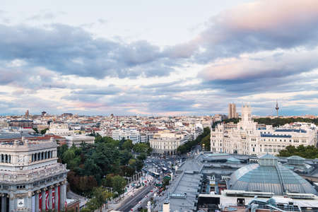 MADRID - OCTOBER 5, 2021: Aerial view of Madrid skyline at dusk, with the City Hall in Plaza de Cibeles and other landmarks to be recognized in the background.のeditorial素材