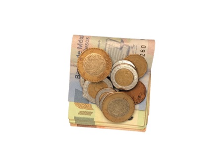 Various mexican coins on top of some peso bills of 20, 100, 200 and 500 folded and grouped isolated on white backgroundの写真素材
