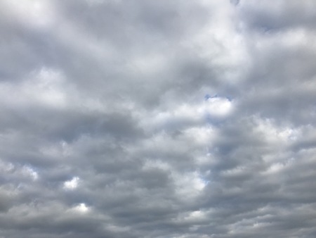 Some clouds on a bright day during summerの写真素材