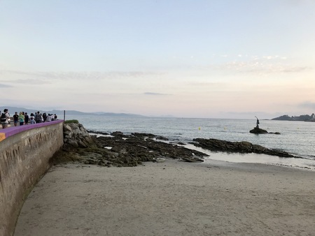 View of the beach and the sea from the seafront of Silgar beach in Sanxenxo during a cloudy day in...