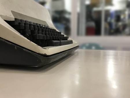 Closeup of a white and black vintage typewriter Closeup of a white and black vintage typewriter