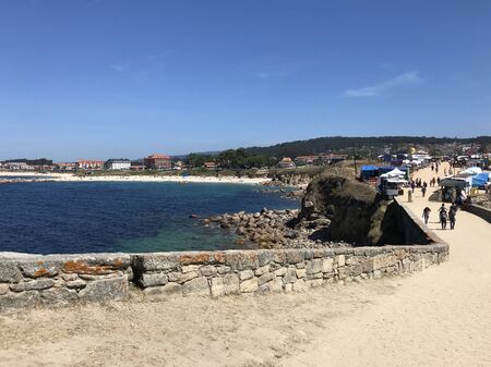 Sanxenxo, Pontevedra / Spain - August 26 2018: View of the beach of Lanzada in Sanxenxo from a bridge during a sunny summer dayのeditorial素材