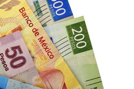 A group of 20 50 100 200 and 500 mexican peso bills isolated on white backgroundの写真素材