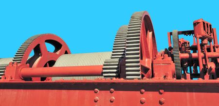 red gear assembly on blue backgroundの写真素材