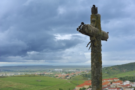 old cross and cloudly sky (Extremadura, Spain)の写真素材