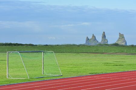 stadium of Vik, Iceland on the background of Reynisdrangar Rocks