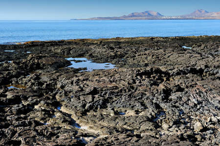 on the coast of volcanic island - Lanzarote, Canary Islands, Spainの写真素材