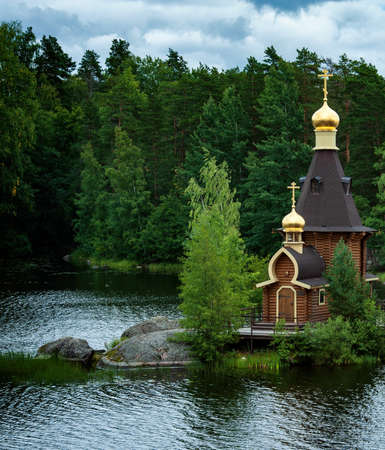 wooden ortodox church of the Apostle Saint Andrew the First Called at a lake island in Russiaの写真素材