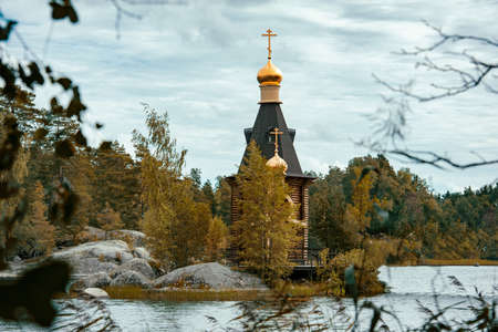 wooden ortodox church of the Apostle Saint Andrew the First Called at a lake island in Russiaの写真素材