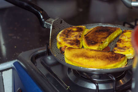 Colombian yellow arepas on a panの写真素材