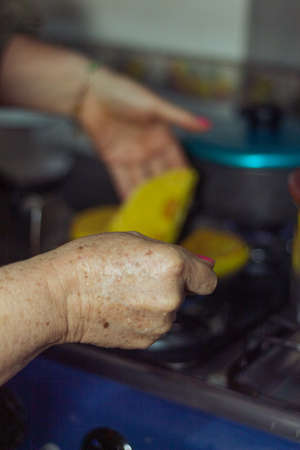 Hands of a woman cookingの写真素材