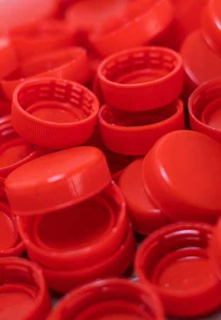 Vertical image of closeup to red plastic bottle capsの写真素材
