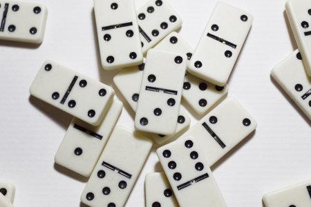 Messy dominoes on a white backgroundの写真素材