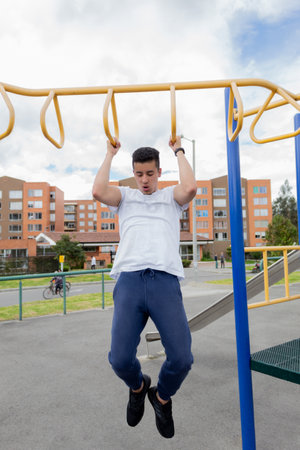 A young man exercising in a park on a sunny day