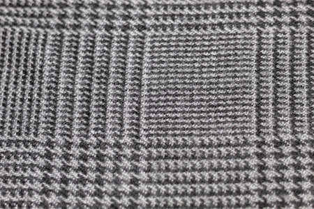 Close up to a checkered wool fabric