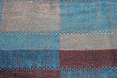 Closeup view of a blue, red and gray checkered wool fabricの写真素材