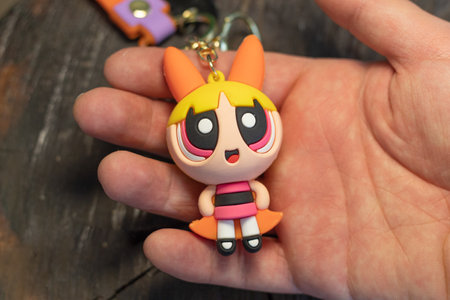 BogotÃ¡, Colombia - December 22, 2022: A man showing a Blossom keychain from the Powerpuff girls...