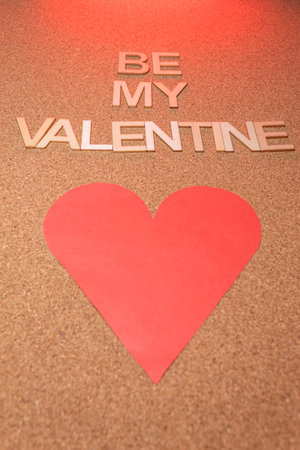 A Valentine's cork card with a red heart. Be my Valentine.の写真素材
