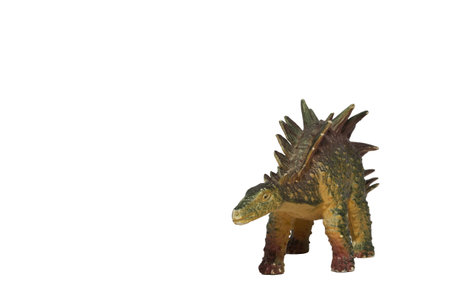 A plastic kentrosaurus isolated on a white background. Toy dinosaur.の写真素材