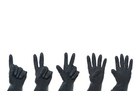 Black rubber gloves counting from one to five on a white background. Hand gestures.の写真素材
