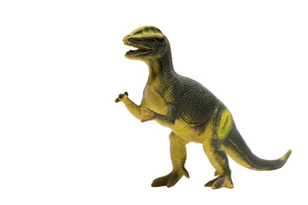 A plastic dinosaur isolated on white background. Dilophosaurus.の写真素材