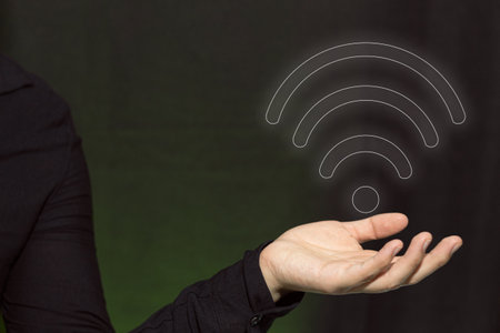 A businessman holding a free wifi symbol. Internet network. Connectivity concept.の写真素材