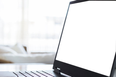 Laptop screen mockup, template background. Laptop with blank screen with defocused background. e-commerce. Home office concept.の写真素材