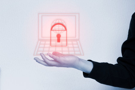 A man holding a digital padlock hologram in front of a laptop. data protection. Antivirus. Cyber lock screen key. Cyber security concept.の写真素材