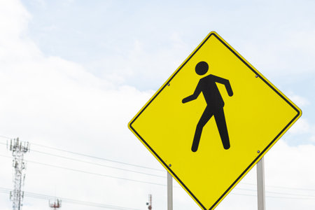 Approach to a traffic sign that announces pedestrians on the road. Signs on the road. Prevention while driving.の写真素材