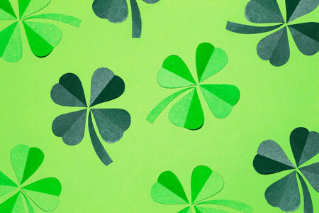 Pattern of green four-leaf clovers on a light background. Decorative design for St. Patrick's Day....