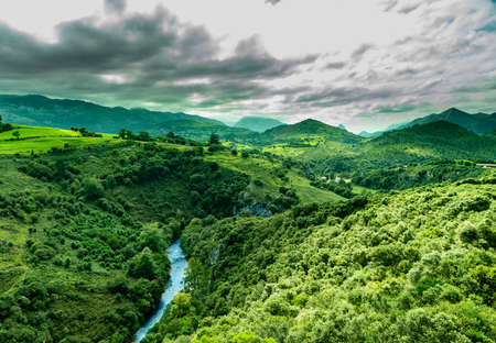 A river between green mountainsの写真素材
