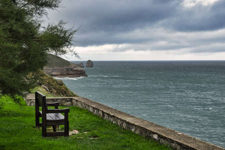 Bench overlooking the seaの写真素材