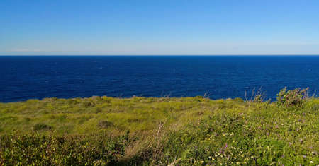 Lines of sky, sea and mountainsの写真素材