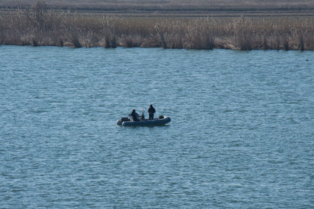 Fishing with a boat in the riverの写真素材