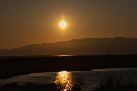 Sunset on the river and the seaの写真素材