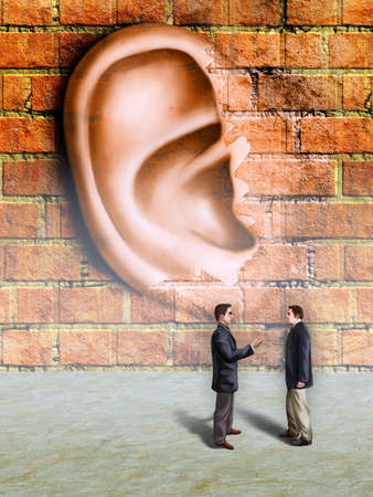 Bussinessmen conversation being spied by a giant ear materializing in a wall. Digital illustration.の写真素材