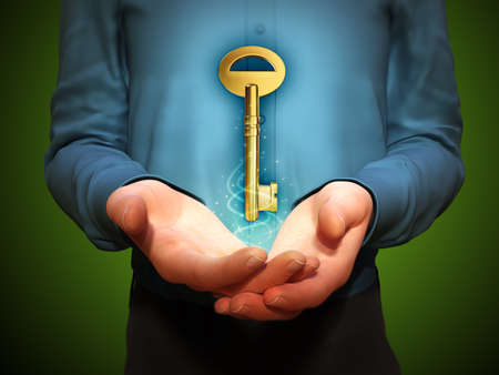 Large golden key floating over a man's cupped hands. 3D illustration.の写真素材