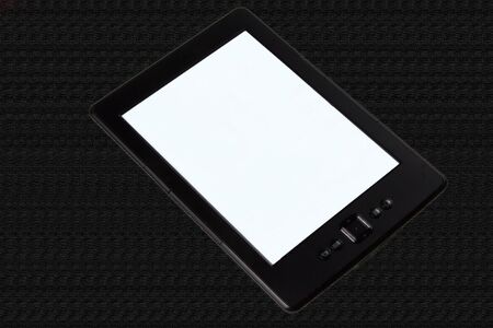 E-reader on black texture の写真素材