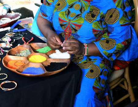 African lady creating unique necklacesの写真素材