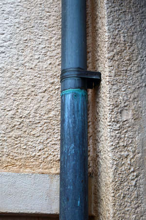Drain pipe running down wall