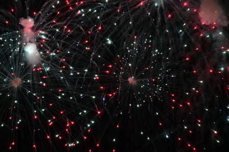 Red and white fireworks exploding in the sky