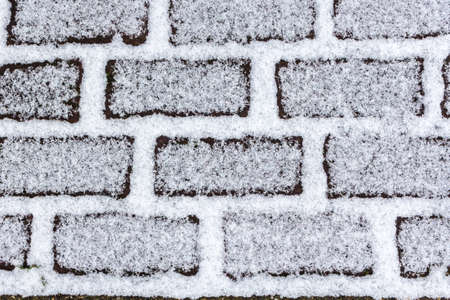 snow on brick background textureの写真素材
