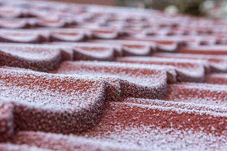winter frost on roof tilesの写真素材