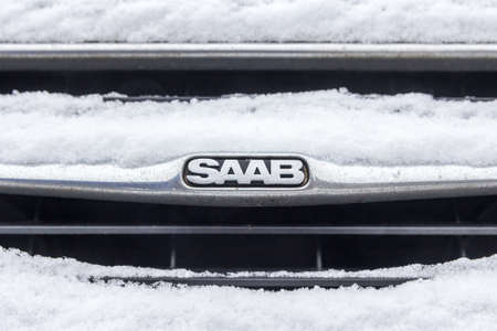 The Hague, the Netherlands - February 11, 2017: Saab emblem covered in snow emblem