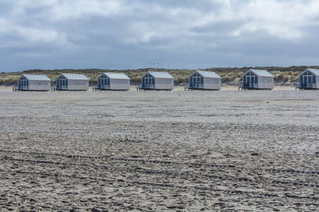 Kijkduin beach, the Netherlands - April 06 2017: beach huts looking out over the seaのeditorial素材