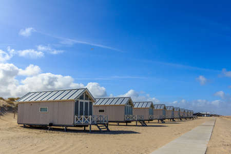 Kijkduin beach, the Netherlands - April 06 2017: beach huts looking out over the seaのeditorial素材