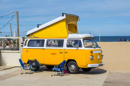Scheveningen beach, the Netherlands - May 21, 2017: yellow VW combi camper wagen at Aircooled classic car showのeditorial素材