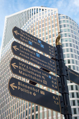 The Hague, the Netherlands - 26 November 2016: street direction sign in The Hague with tall building in backgroundのeditorial素材